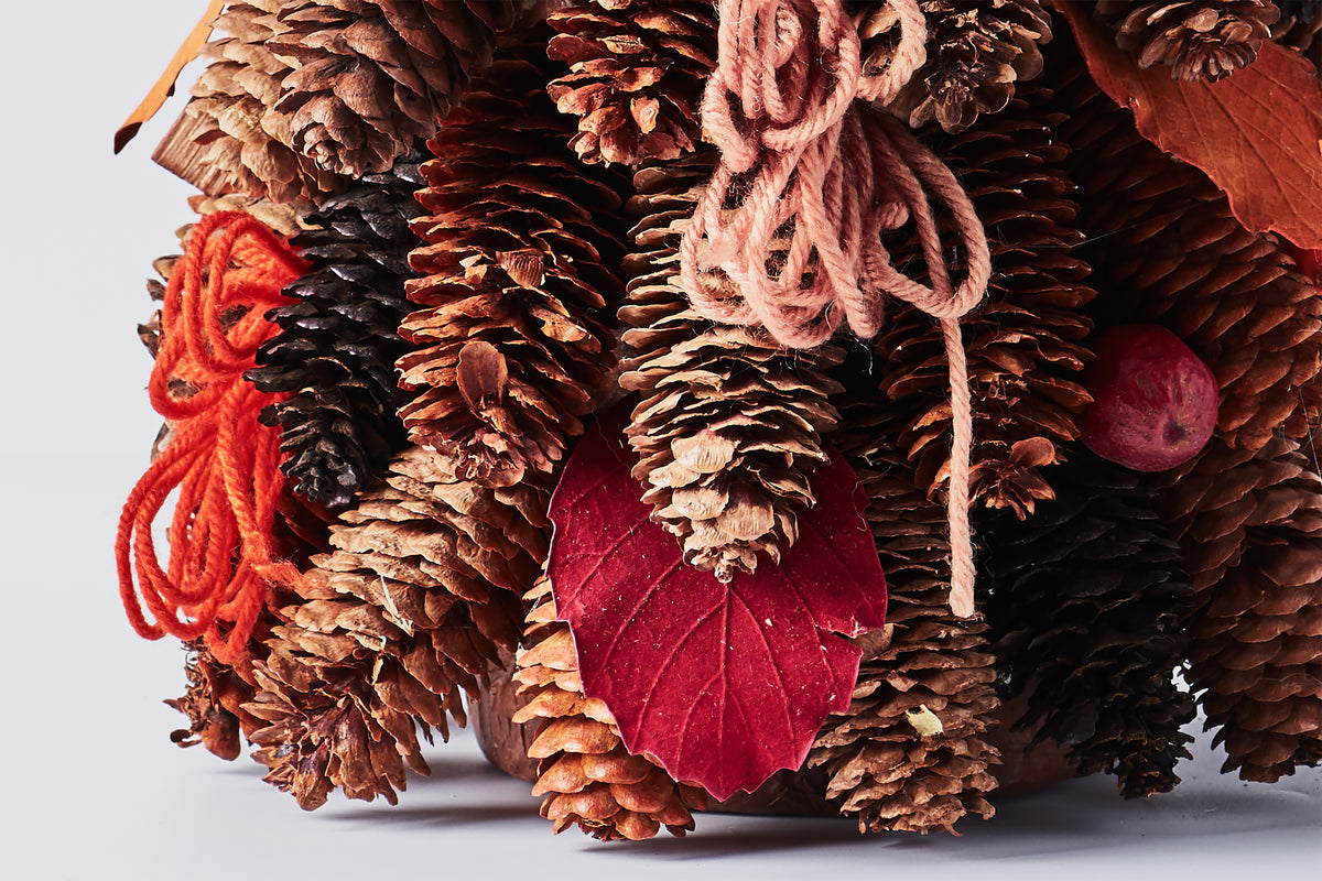 Handcrafted Tree with Pinecones and Wood Chips